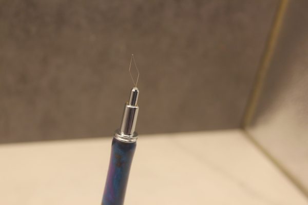 Closeup of the needle threader end of the 2 in 1 stitch stiletto and needle threader