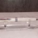Trimline pen featuring dark glitter pearl finish with chrome accents, adding subtle sparkle to professional writing instrument.