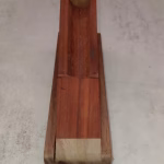 Open, in reverse handcrafted pen box in vibrant padauk wood with rich orange-red tones and natural grain, offering protective storage with exotic hardwood beauty.