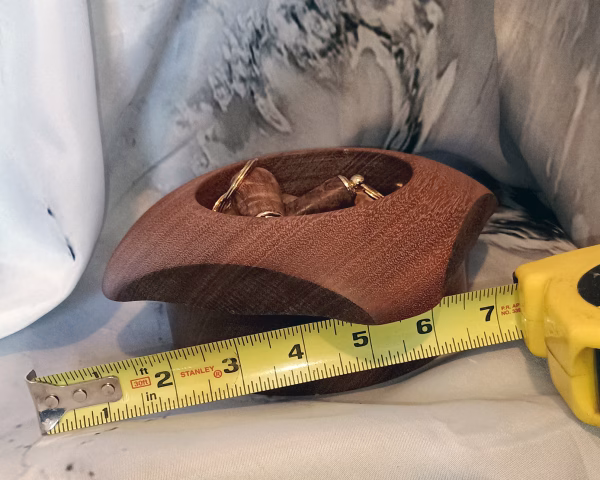 Square sapele wood bowl with size reference – rich grain and sharp geometric lines