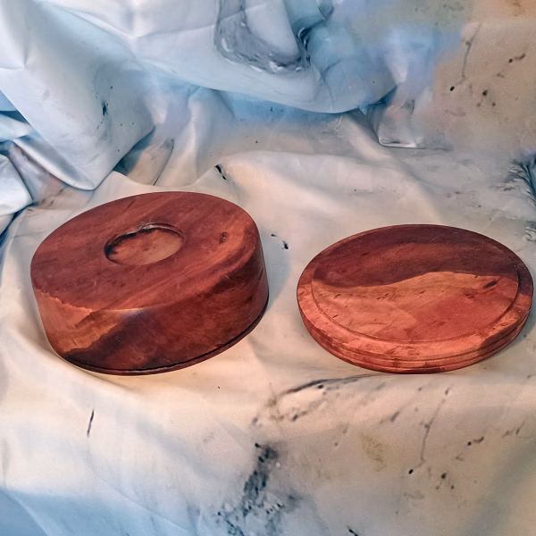Rich red gum bowl showcasing swirling grain patterns and glossy oiled exterior