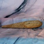 Reclaimed hardwood cawl spoon with hand-carved herringbone pattern along handle, artisan kitchen utensil