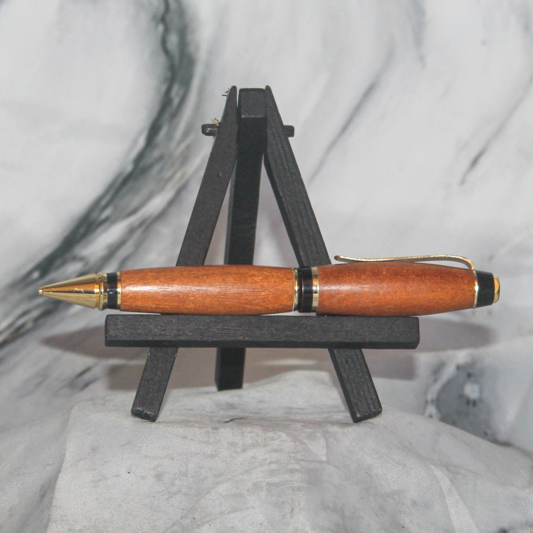 Cigar Pencil with Black & Gold Hardware and Honduran Mahogany Body in warm honey tones.
