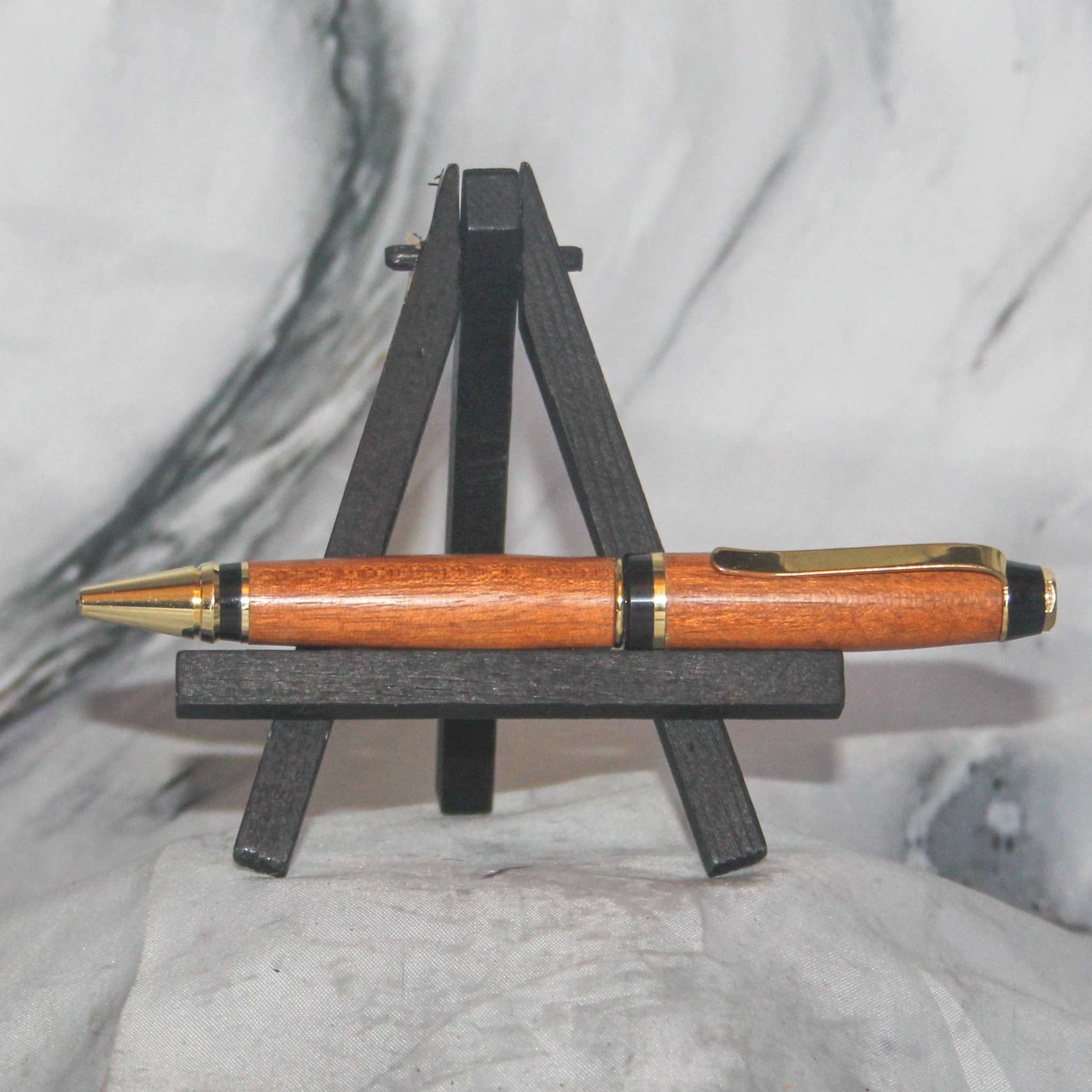 Cigar Pen with Black & Gold Hardware and Honduran Mahogany Body in warm honey tones.