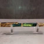 Slimline pen with gold hardware and a hybrid blank that is green and reflective gold.