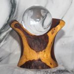 Palo Verde crystal ball holder showing dramatic sapwood and heartwood contrast with live edge accents and included 60mm crystal ball